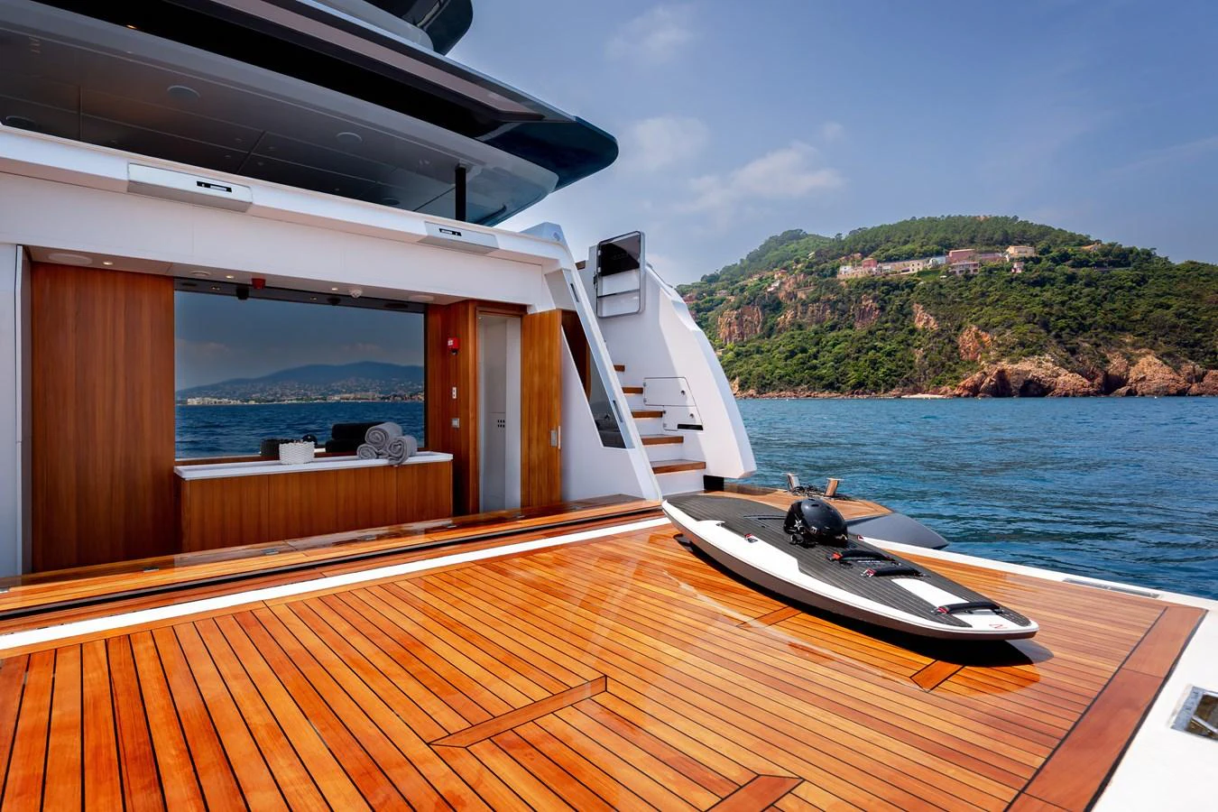 The aft deck features a sleek, modern design with a spacious area for relaxation and water activities. aboard LADY DIA Yacht for Sale