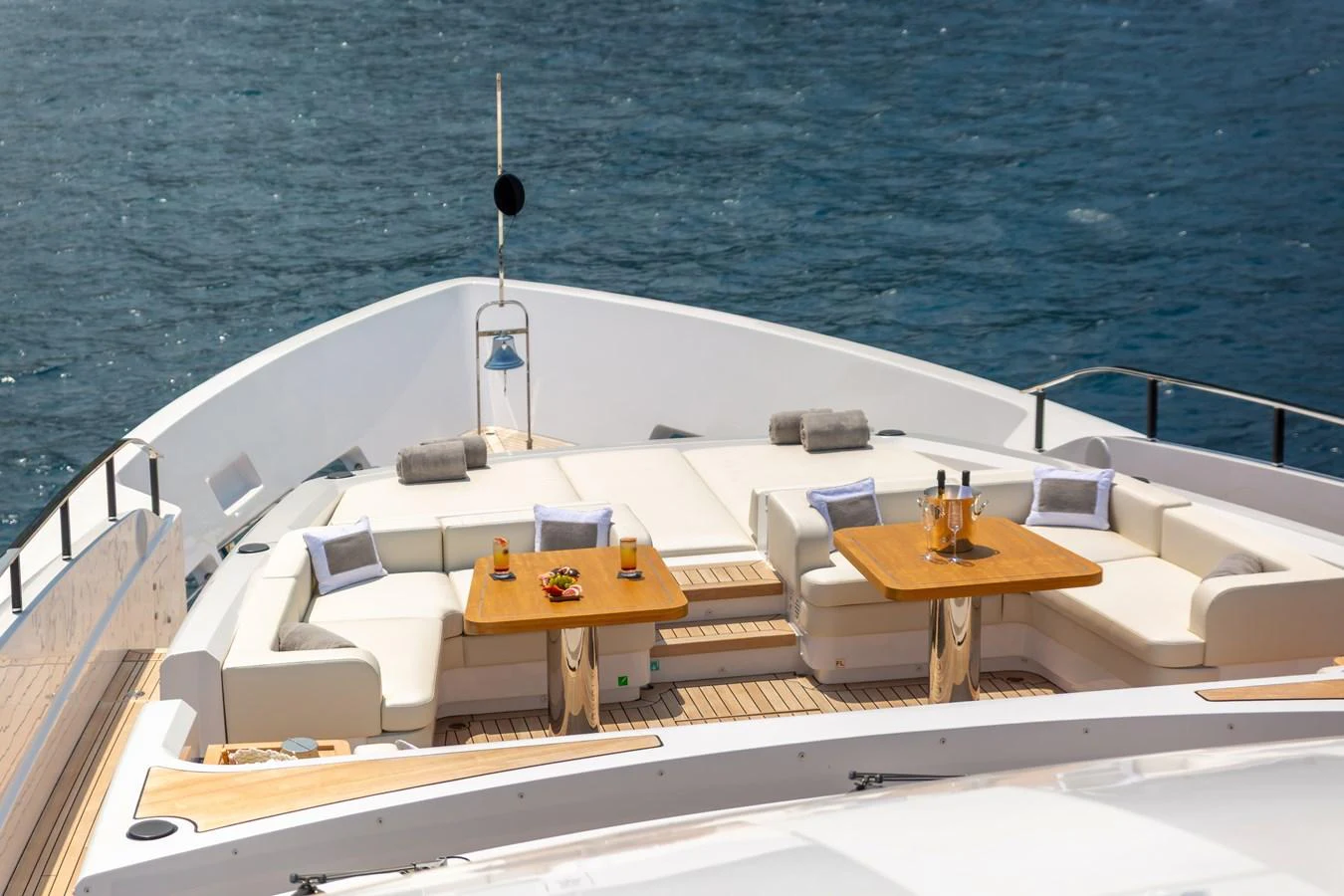 The sundeck offers a luxurious lounging area with comfortable seating and tables for refreshments. aboard LADY DIA Yacht for Sale
