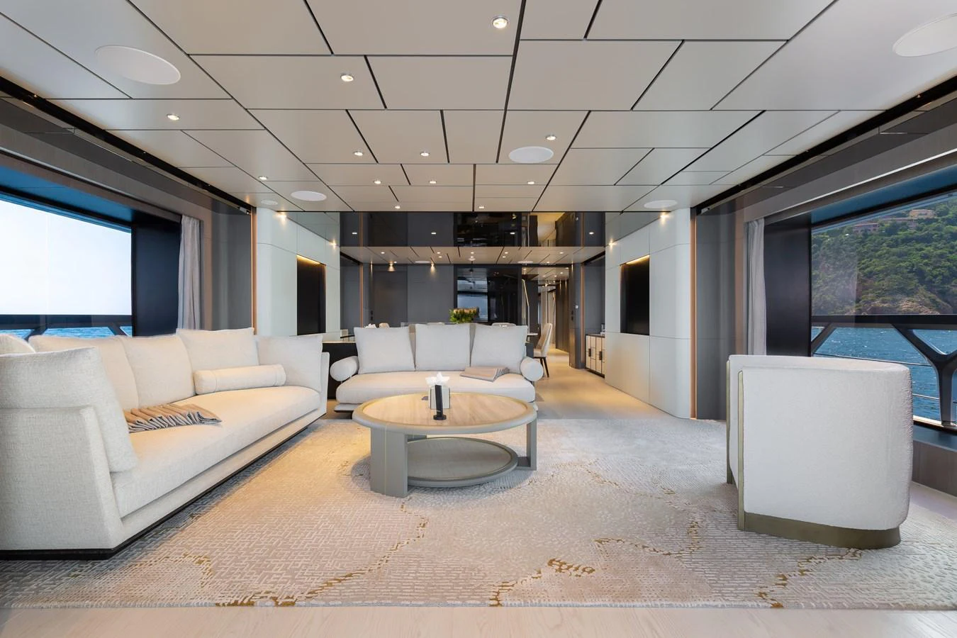 The salon features elegant seating and expansive windows offering stunning sea views. aboard LADY DIA Yacht for Sale