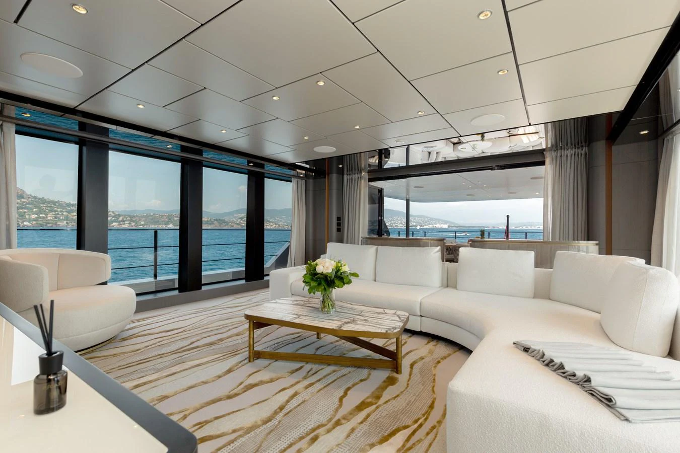 The salon offers a luxurious and spacious seating area with panoramic views of the sea. aboard LADY DIA Yacht for Sale