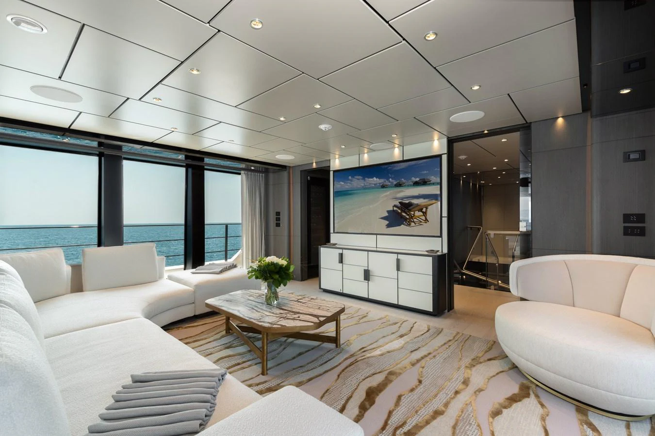 The salon offers a luxurious and spacious seating area with modern decor and stunning ocean views. aboard LADY DIA Yacht for Sale