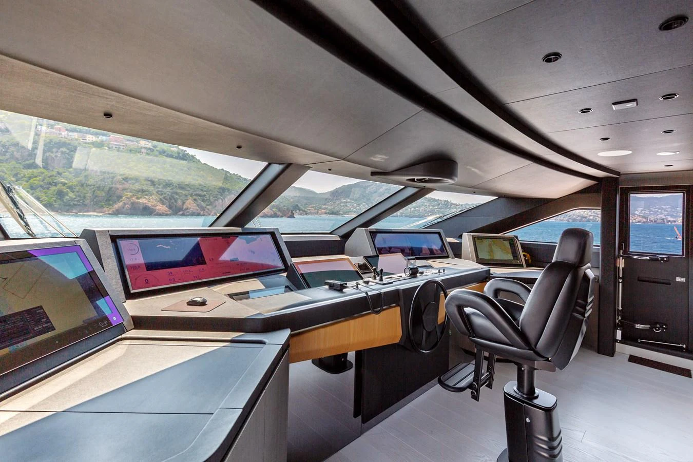 The helm station features advanced navigation equipment and panoramic views. aboard LADY DIA Yacht for Sale
