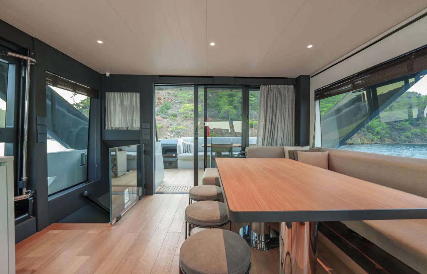 The salon offers a spacious and modern interior with ample natural light and comfortable seating. aboard OUT OF THE BLUE Yacht for Sale