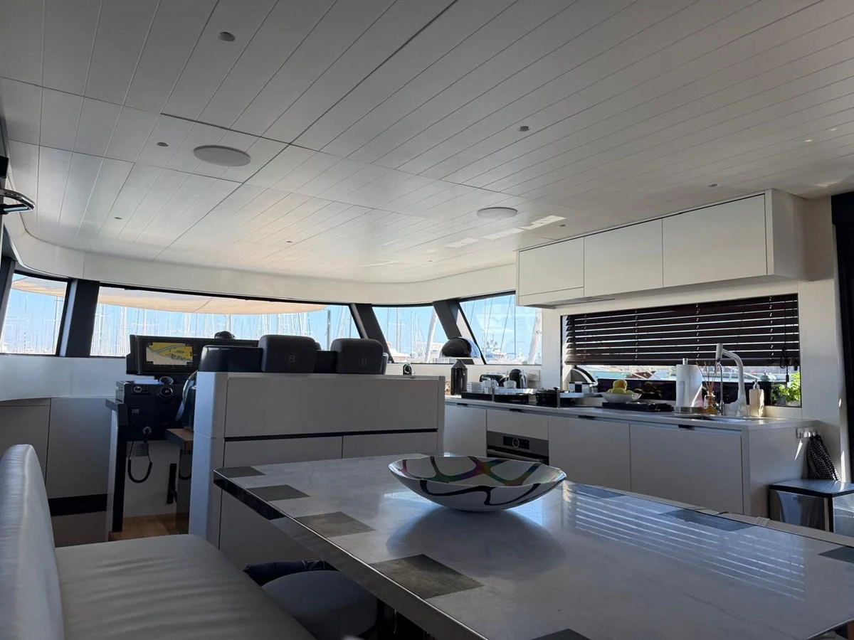 The yacht's galley features modern amenities and a sleek design, perfect for onboard dining and entertaining. aboard OUT OF THE BLUE Yacht for Sale