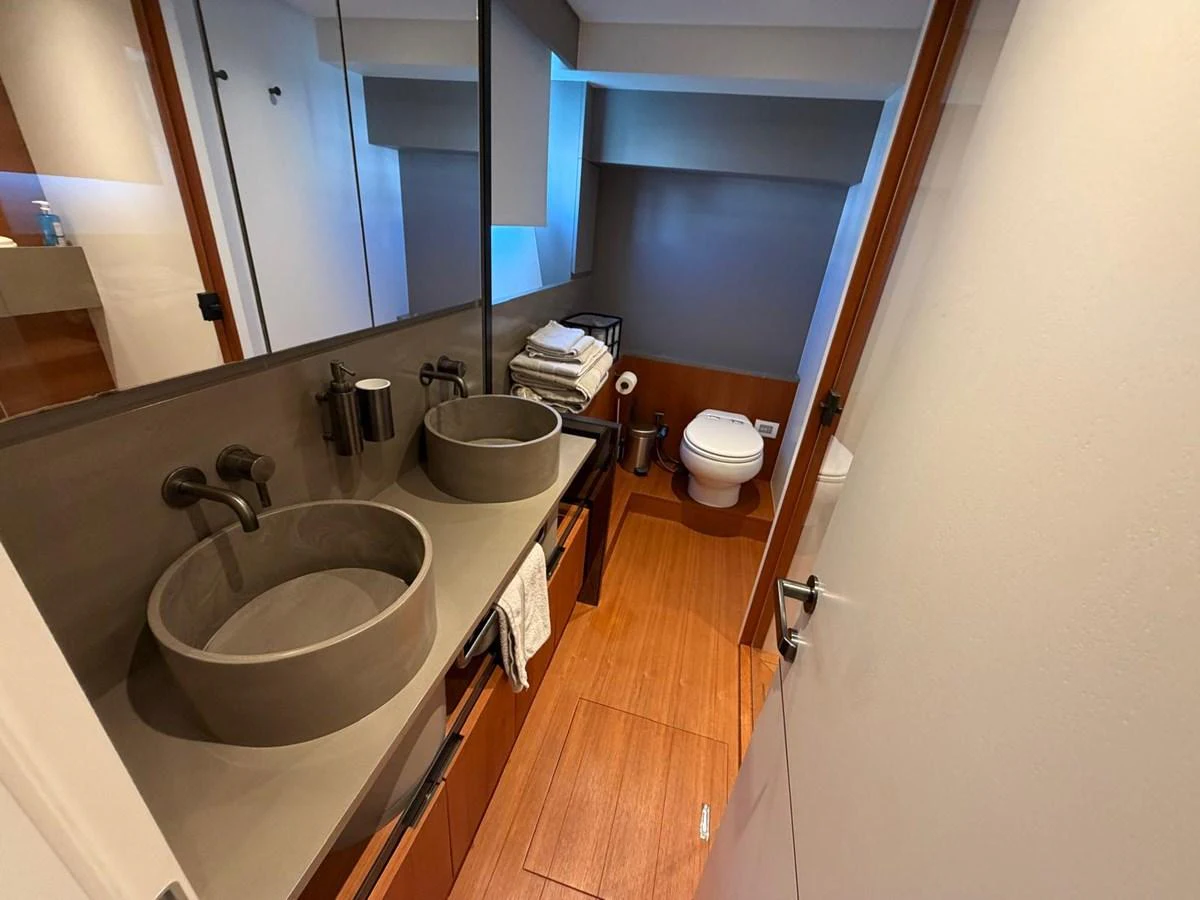 The yacht's bathroom features modern fixtures and a sleek design. aboard OUT OF THE BLUE Yacht for Sale