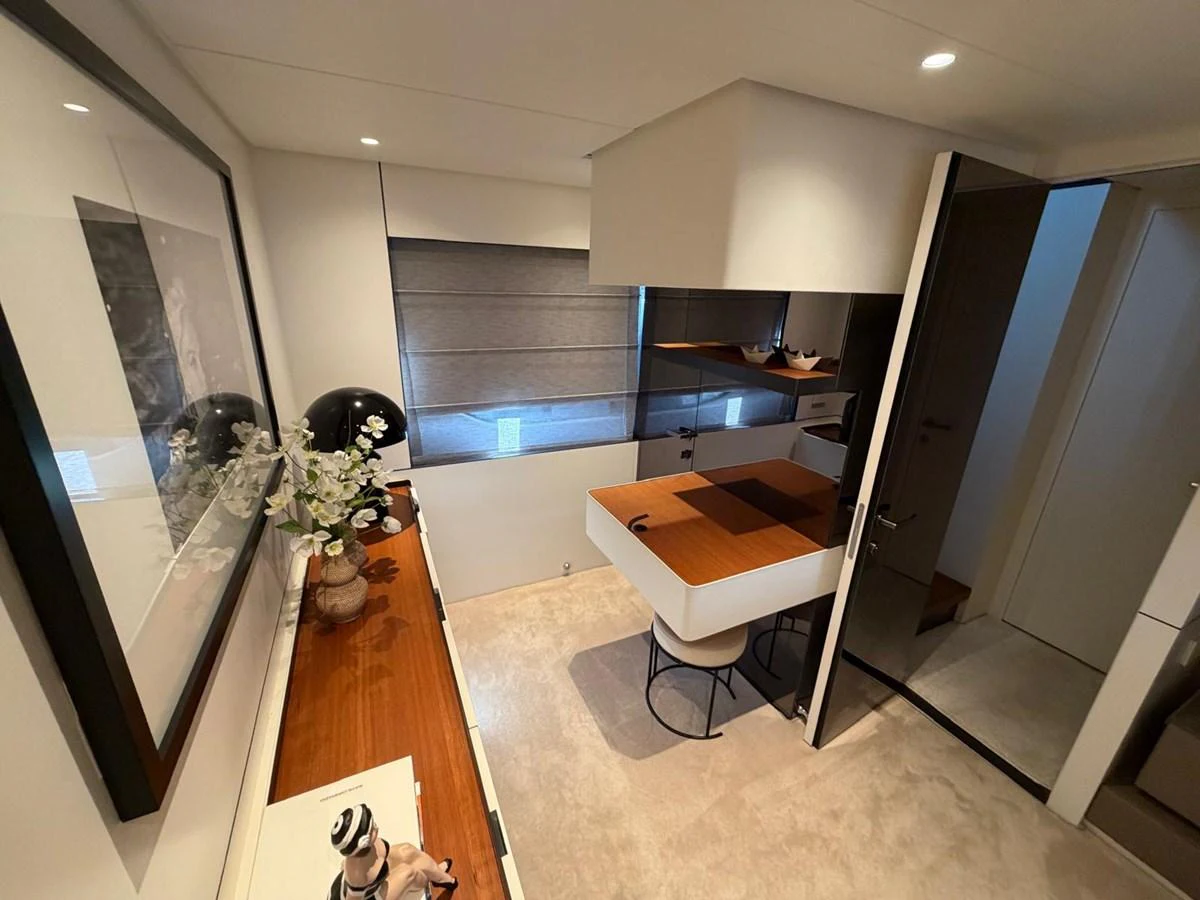 A cozy and modern interior space featuring a small dining area and stylish decor. aboard OUT OF THE BLUE Yacht for Sale
