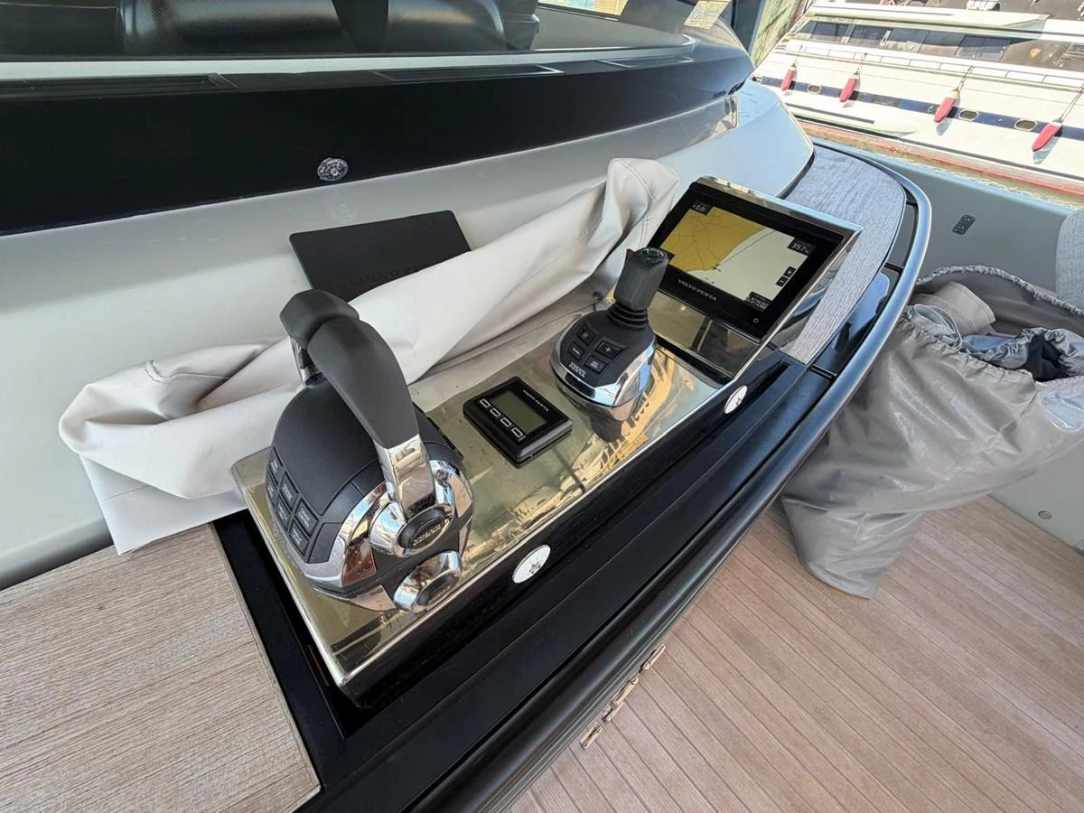 A close-up of the yacht's helm controls showcasing modern navigation equipment. aboard OUT OF THE BLUE Yacht for Sale