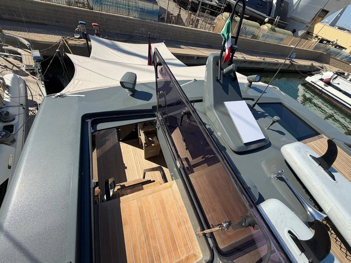 The flybridge offers a spacious and inviting area with comfortable seating and a clear view of the surroundings. aboard OUT OF THE BLUE Yacht for Sale