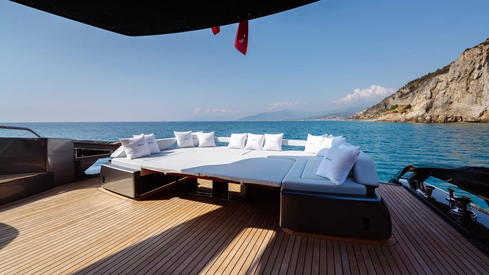 The sundeck features a spacious lounging area with plush cushions, offering stunning views of the surrounding sea and coastline. aboard MAYAR Yacht for Sale
