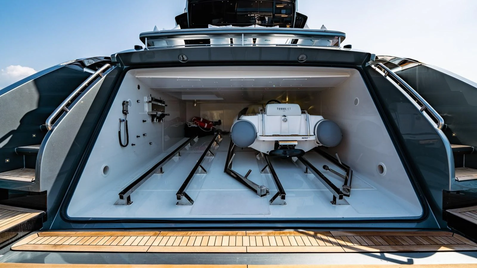 The yacht features a spacious garage with a tender and additional storage for water toys. aboard MAYAR Yacht for Sale