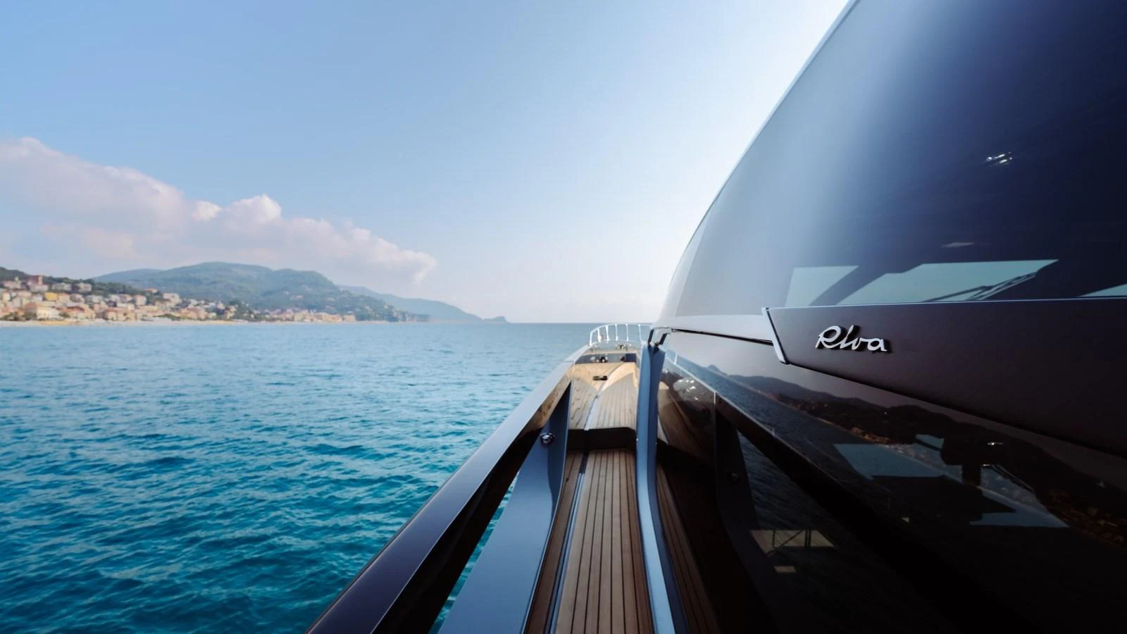 A sleek yacht detail shot showcasing the polished deck and reflective surfaces against a serene coastal backdrop. aboard MAYAR Yacht for Sale
