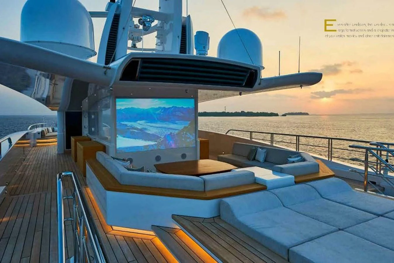 The sundeck features a luxurious outdoor cinema setup with comfortable seating and a large screen, perfect for evening entertainment. aboard DYTAN Yacht for Sale