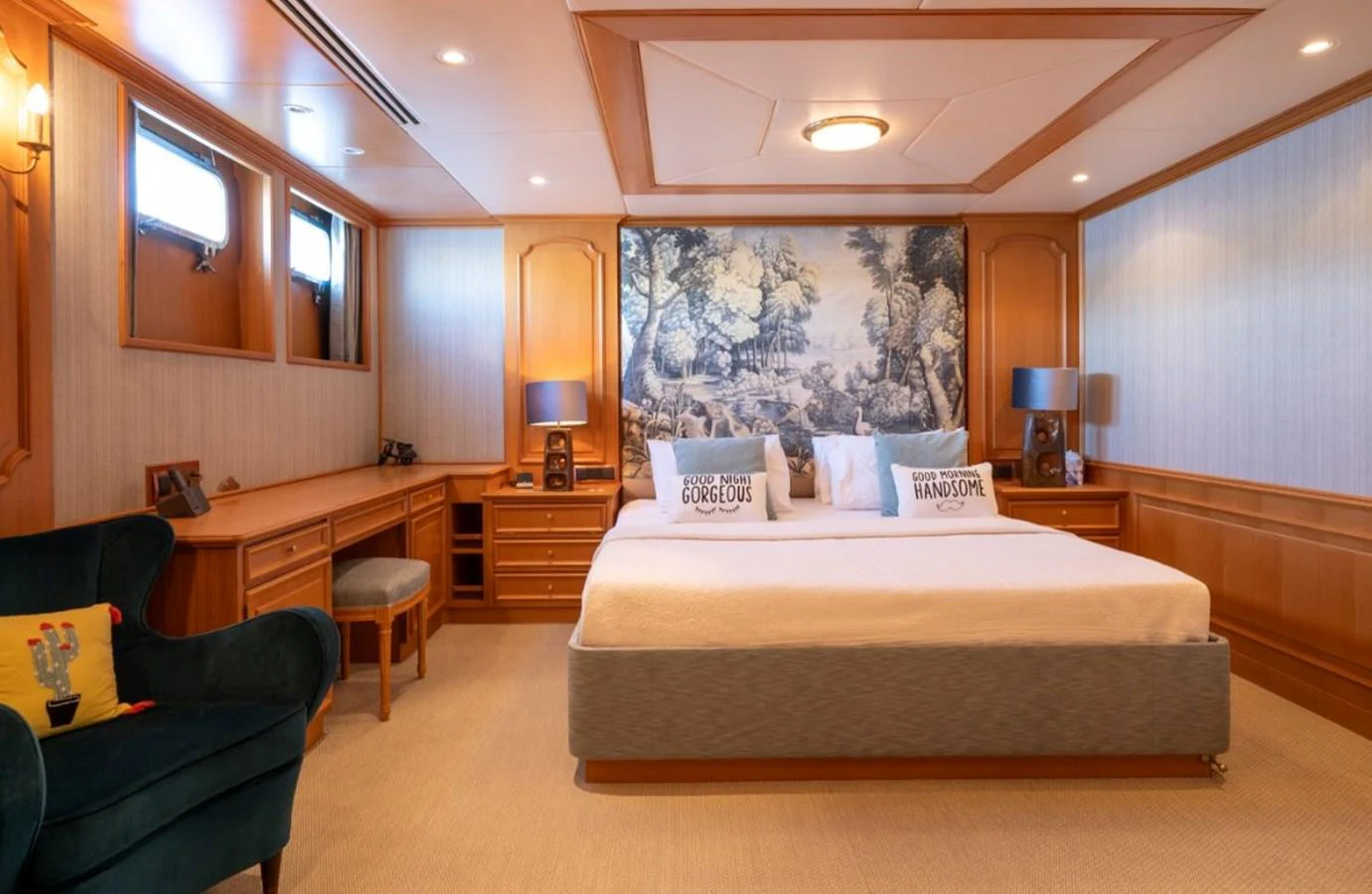 The master stateroom features a spacious bed, elegant wood paneling, and tasteful decor. aboard STELLA FIERA II Yacht for Sale