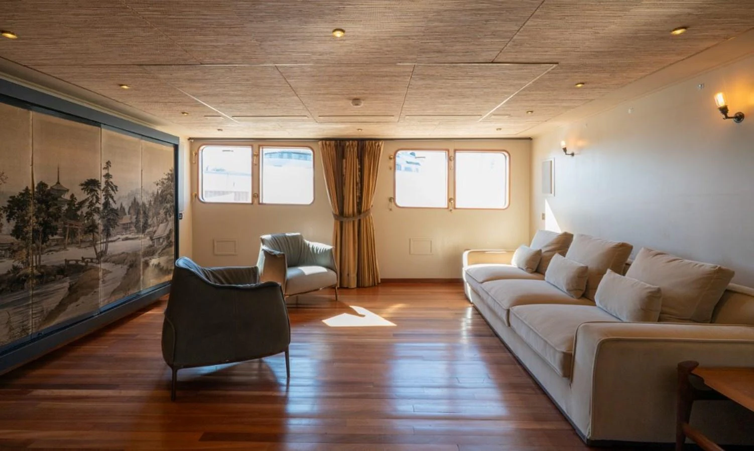 The salon features a spacious seating area with elegant furnishings and ample natural light. aboard STELLA FIERA II Yacht for Sale