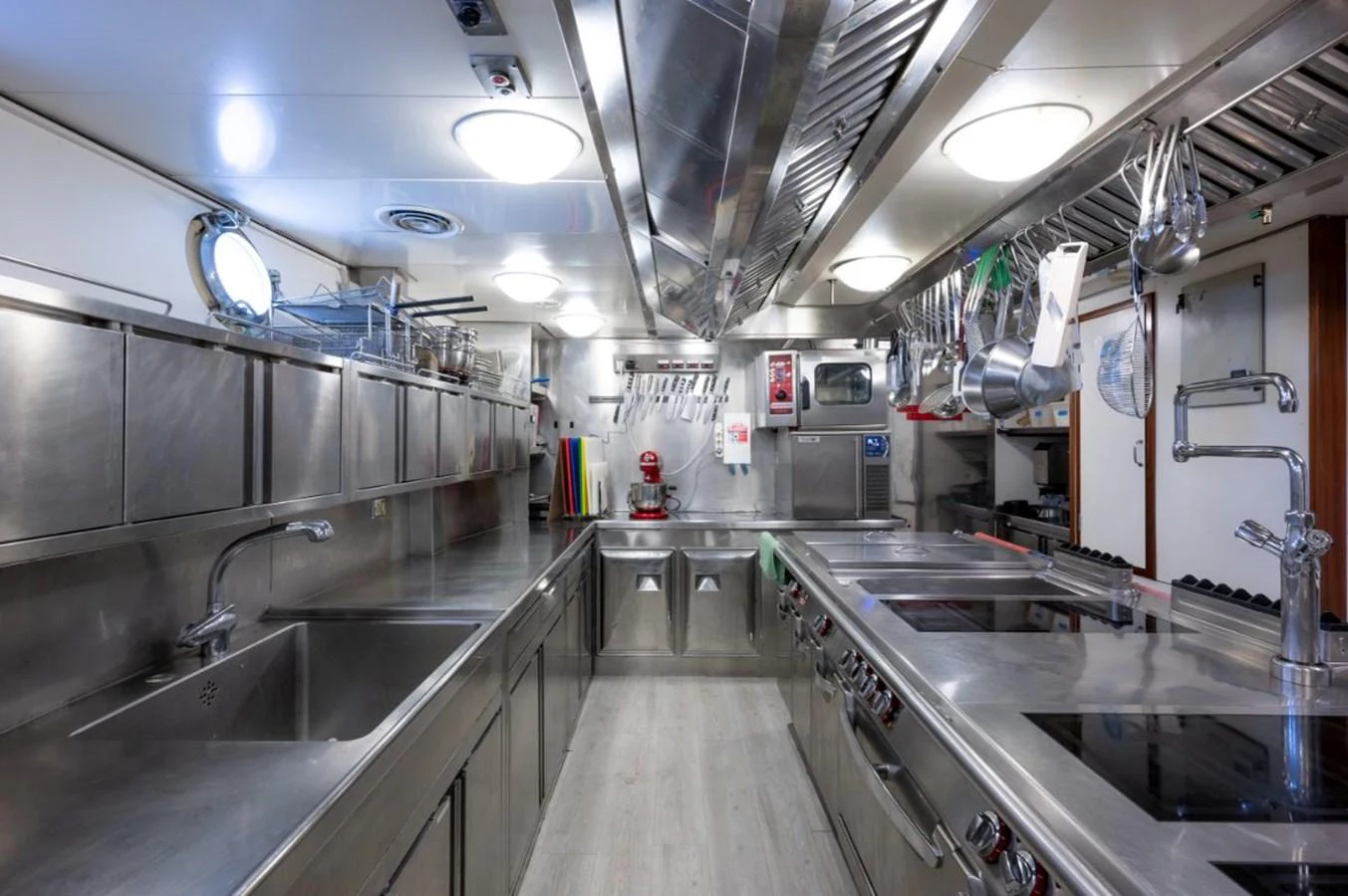 The yacht's galley is equipped with modern stainless steel appliances and ample workspace for gourmet meal preparation. aboard STELLA FIERA II Yacht for Sale