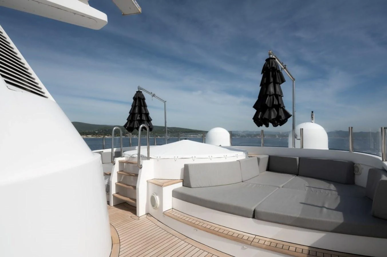 The sundeck features a spacious lounging area with comfortable seating and a hot tub, perfect for relaxation under the sun. aboard STELLA FIERA II Yacht for Sale
