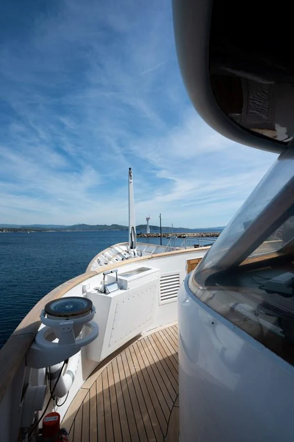 The yacht's deck offers a stunning view of the open sea under a clear blue sky. aboard STELLA FIERA II Yacht for Sale