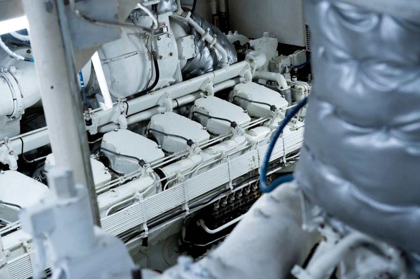 The image showcases the intricate machinery within the yacht's engine room. aboard STELLA FIERA II Yacht for Sale