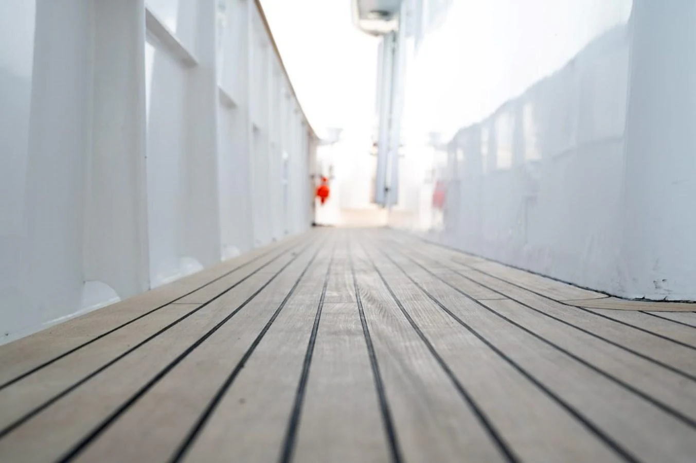 A close-up view of the yacht's teak deck, showcasing its clean lines and quality craftsmanship. aboard STELLA FIERA II Yacht for Sale