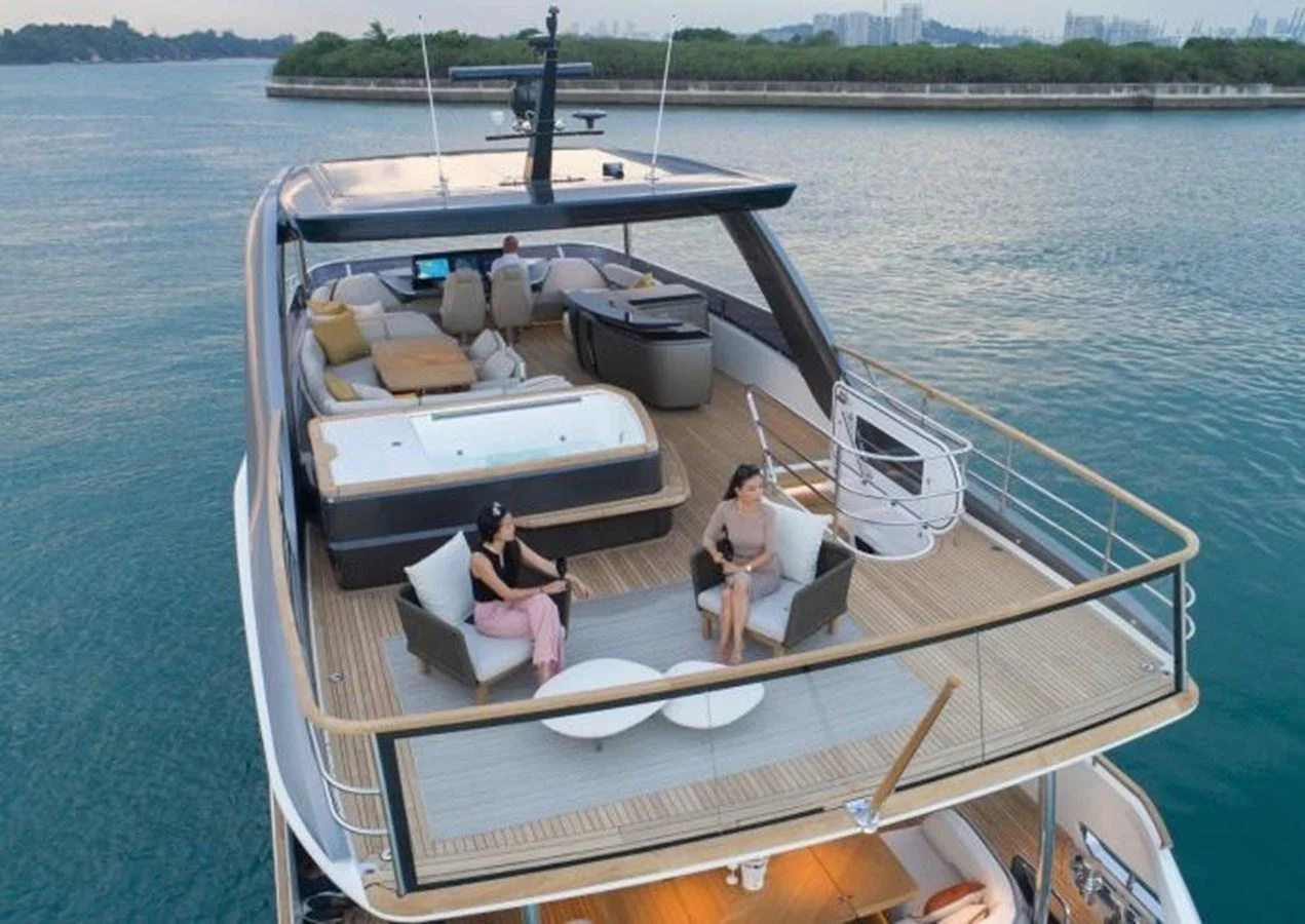 The flybridge offers a spacious and luxurious area for relaxation and socializing with stunning views. aboard MOONFLOWER Yacht for Sale