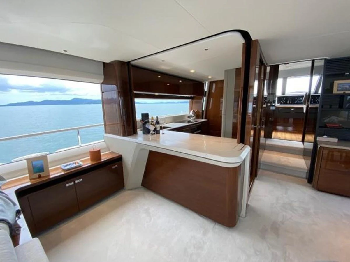 The yacht's galley features modern appliances and a sleek design with a view of the sea. aboard MOONFLOWER Yacht for Sale