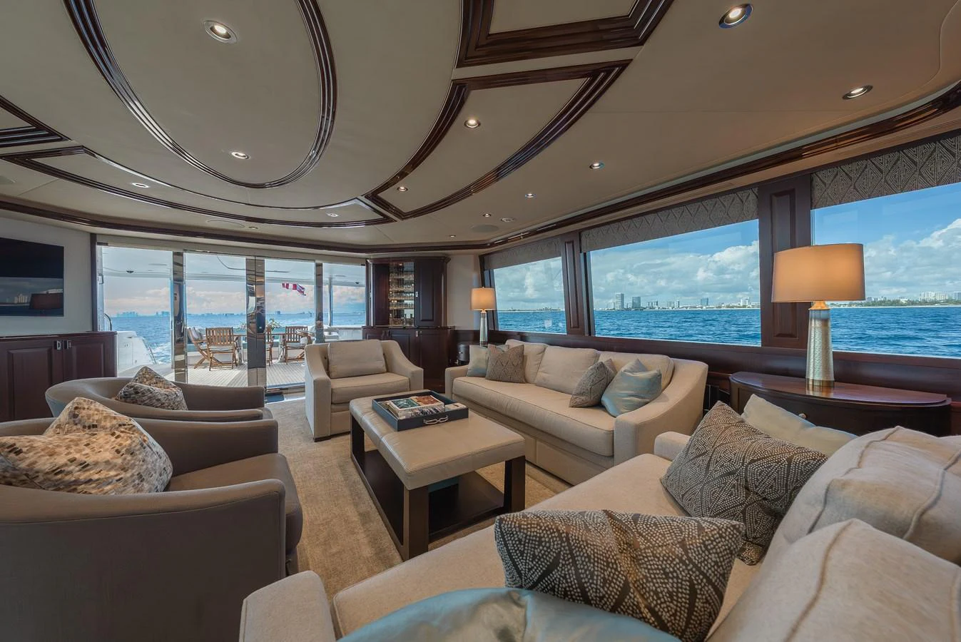 The salon offers a spacious and luxurious seating area with panoramic ocean views. aboard DETERMINATION Yacht for Sale