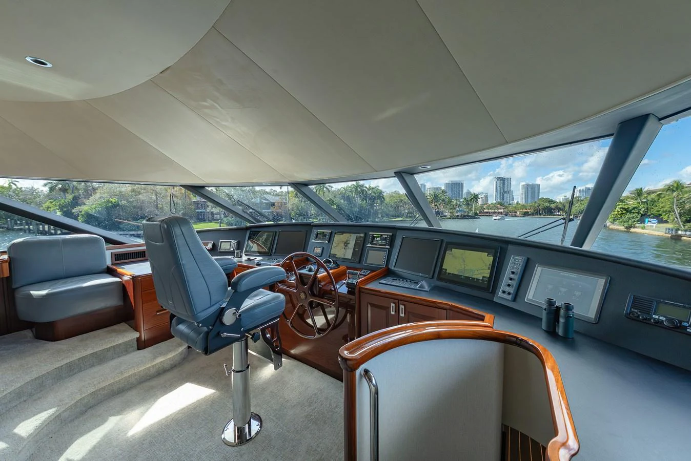 The helm station offers a panoramic view with state-of-the-art navigation equipment and luxurious seating. aboard DETERMINATION Yacht for Sale