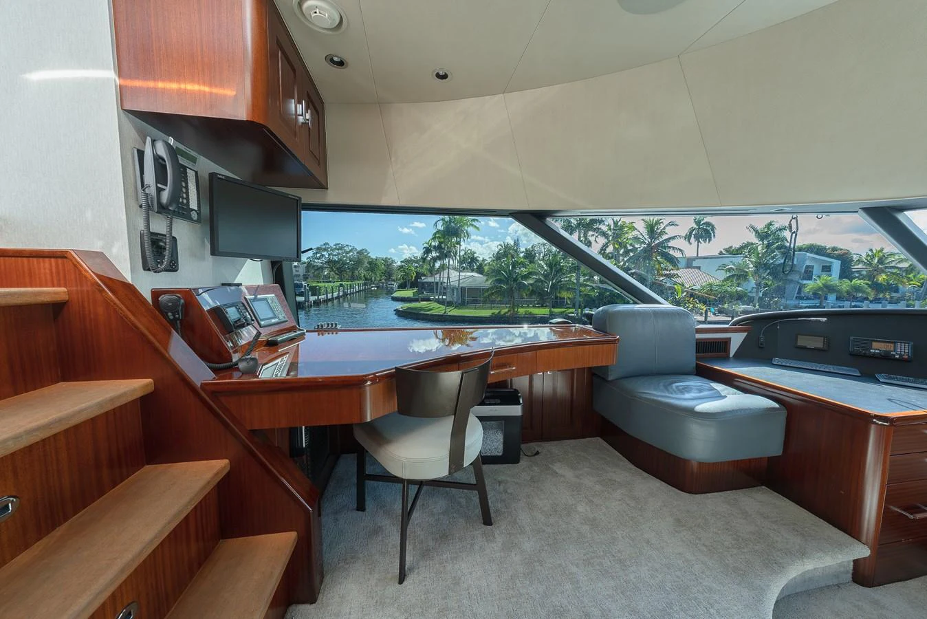 The helm area features a luxurious and spacious design with a panoramic view of the surroundings. aboard DETERMINATION Yacht for Sale
