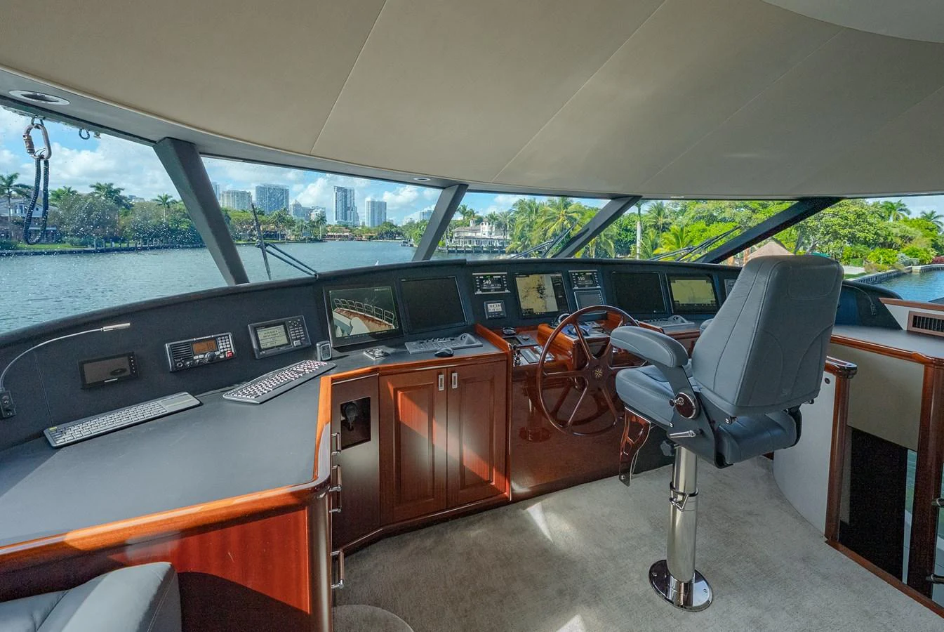 The helm station offers a commanding view with state-of-the-art navigation equipment and luxurious seating. aboard DETERMINATION Yacht for Sale