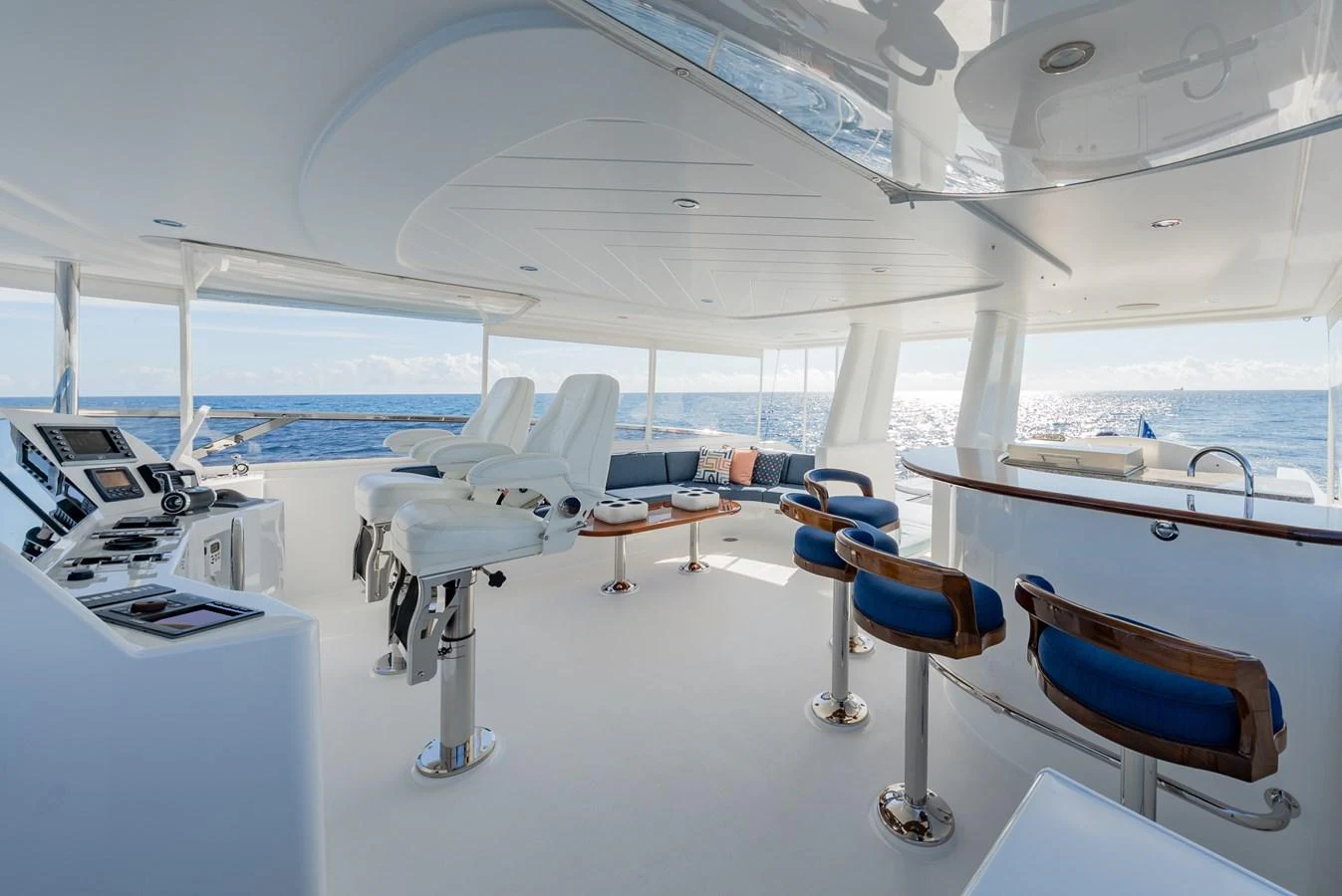 The flybridge offers a spacious and luxurious area with ample seating and a commanding view of the sea. aboard DETERMINATION Yacht for Sale
