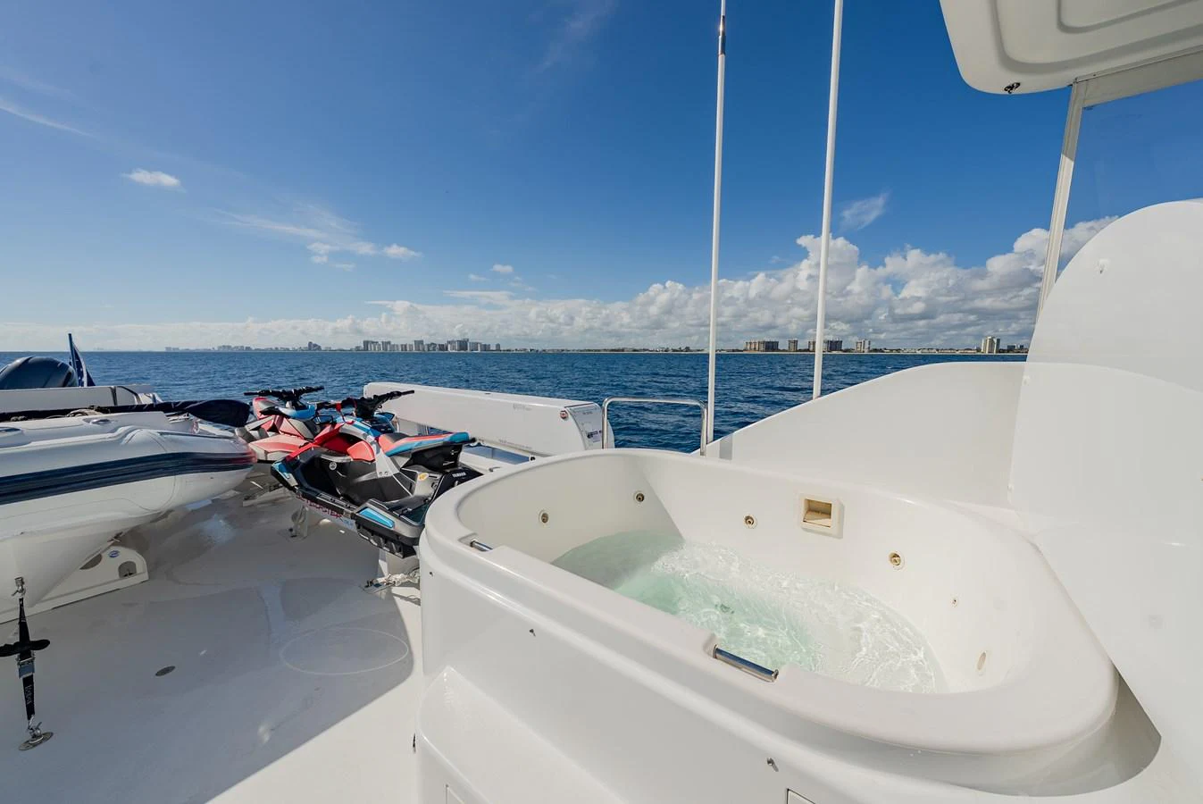 The yacht features a luxurious outdoor jacuzzi and water toys for ultimate relaxation and fun on the water. aboard DETERMINATION Yacht for Sale