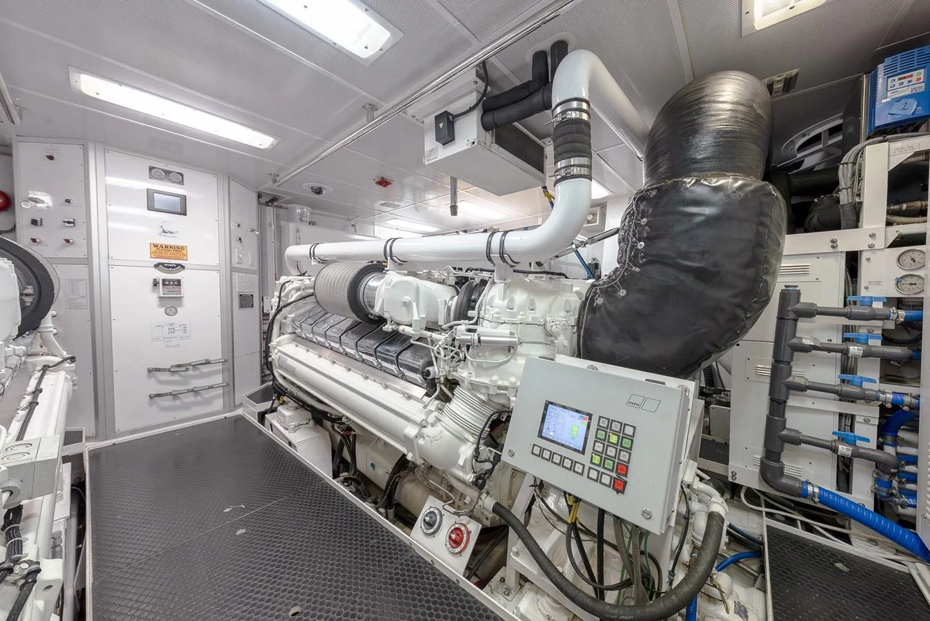 The image showcases the well-maintained engine room of the yacht, highlighting its advanced machinery and clean setup. aboard DETERMINATION Yacht for Sale