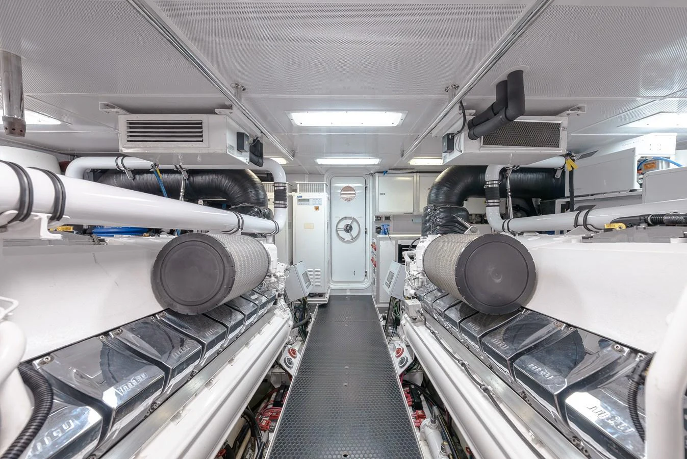 The image showcases the yacht's pristine engine room with advanced machinery and equipment. aboard DETERMINATION Yacht for Sale