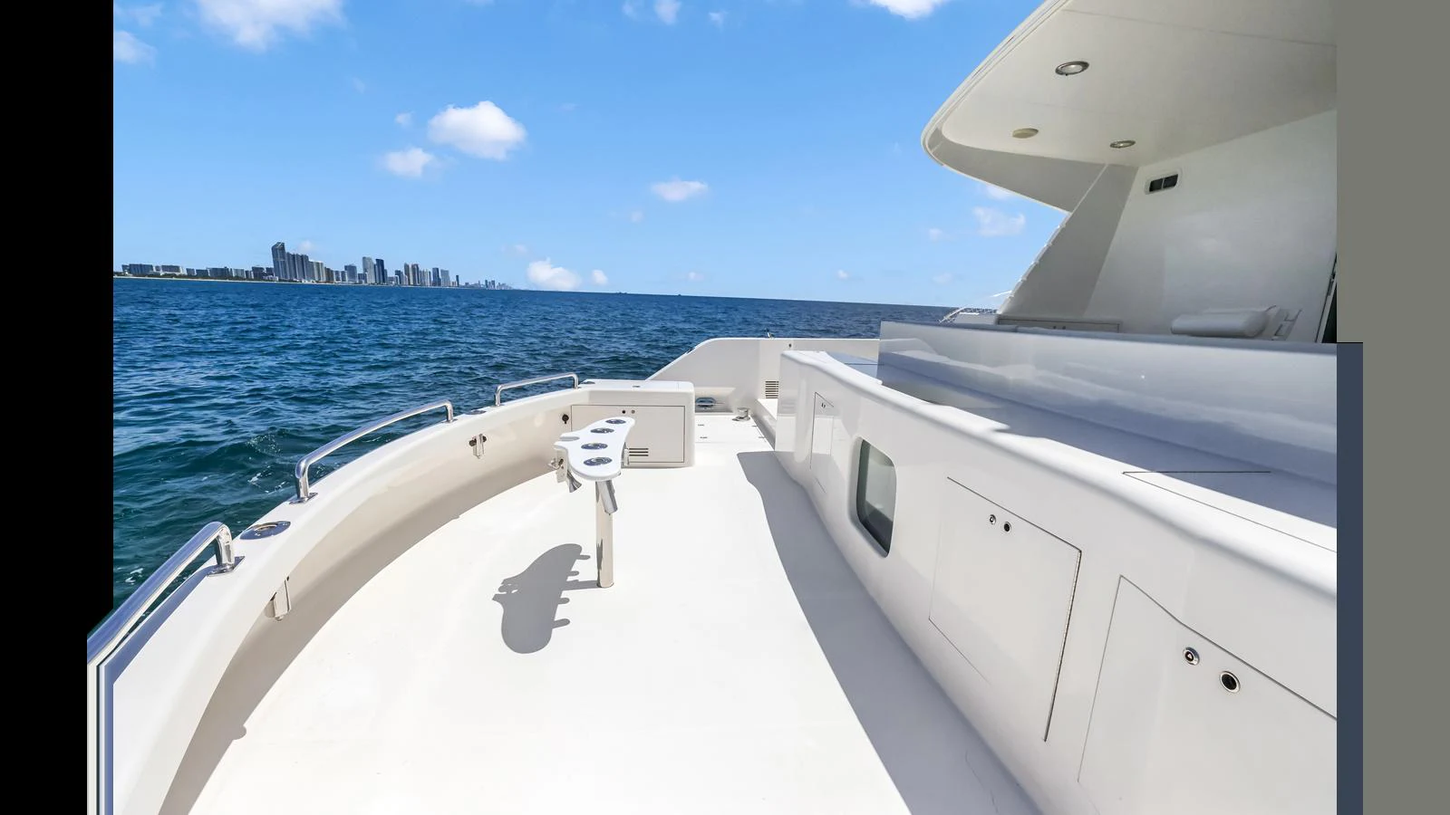 The spacious bow area offers ample seating and stunning views of the ocean and city skyline. aboard MOANA Yacht for Sale
