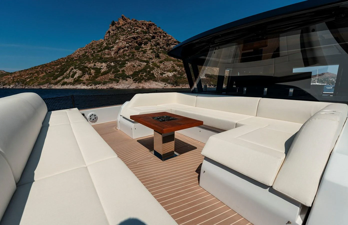 The aft deck features a spacious seating area with a central table, perfect for outdoor relaxation and socializing. aboard LUCKY LUKA Yacht for Sale