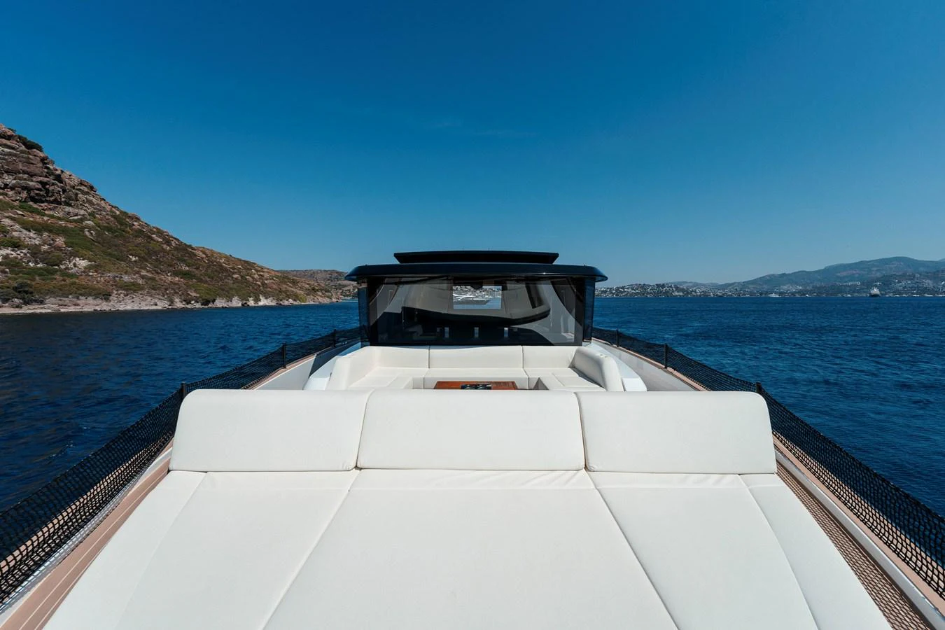 The yacht's sleek exterior features a spacious sunbathing area with stunning views of the surrounding waters. aboard LUCKY LUKA Yacht for Sale