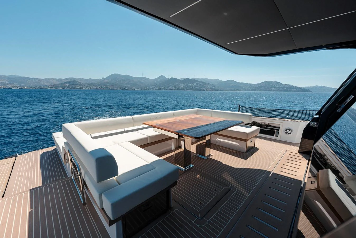 The aft deck offers a spacious and luxurious seating area with stunning ocean views. aboard LUCKY LUKA Yacht for Sale