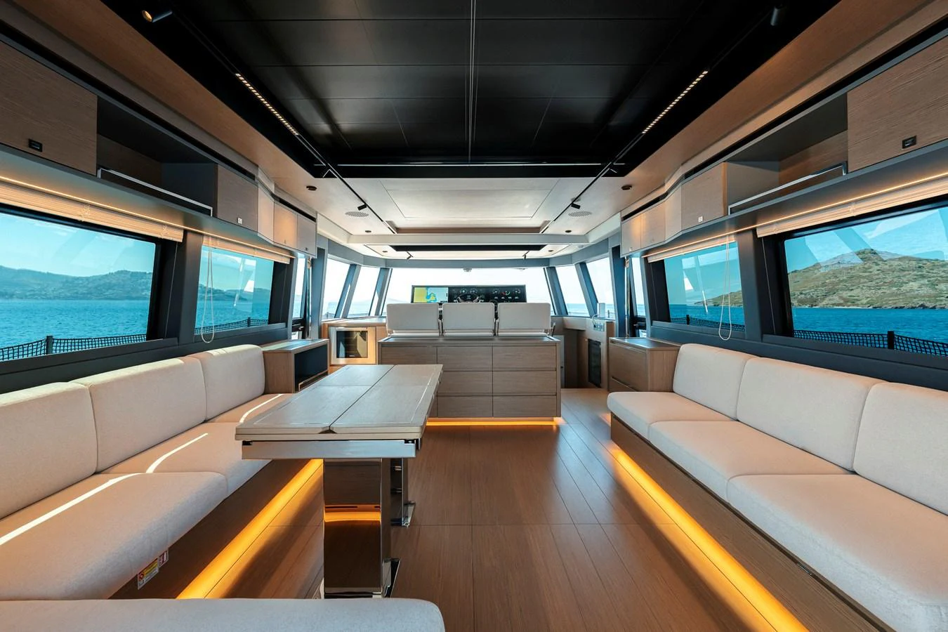 The spacious salon features ample seating and panoramic windows, creating a bright and inviting atmosphere. aboard LUCKY LUKA Yacht for Sale