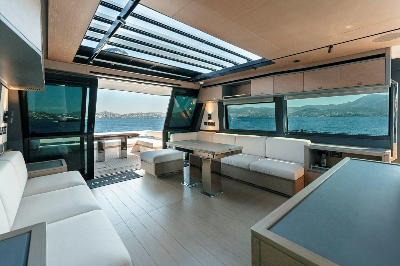 The salon offers a spacious and modern seating area with panoramic views and ample natural light. aboard LUCKY LUKA Yacht for Sale