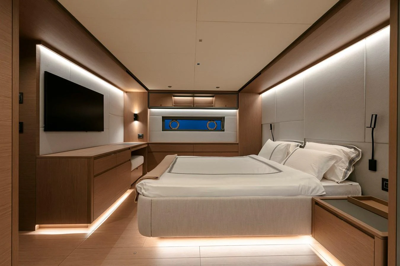 The stateroom features a modern design with elegant lighting and a comfortable bed. aboard LUCKY LUKA Yacht for Sale