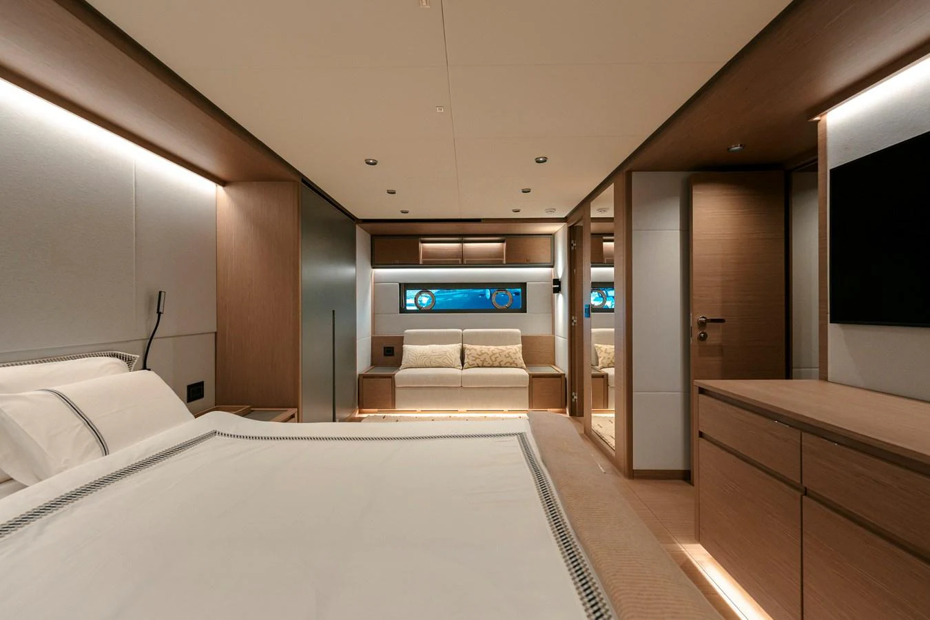 The master stateroom features a luxurious bed, modern furnishings, and ample natural light. aboard LUCKY LUKA Yacht for Sale