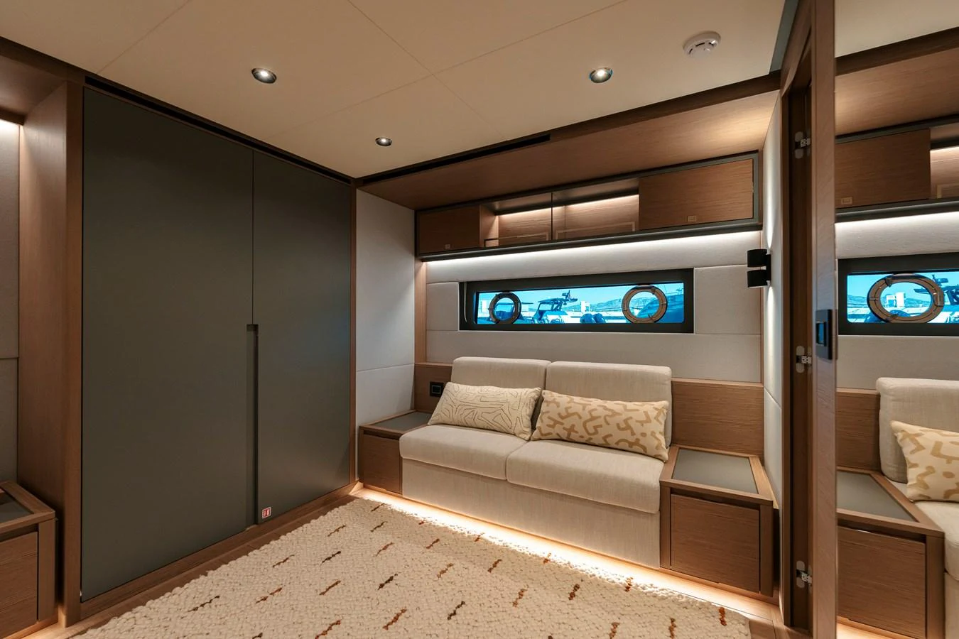 The salon features a cozy seating area with modern lighting and elegant wood finishes. aboard LUCKY LUKA Yacht for Sale