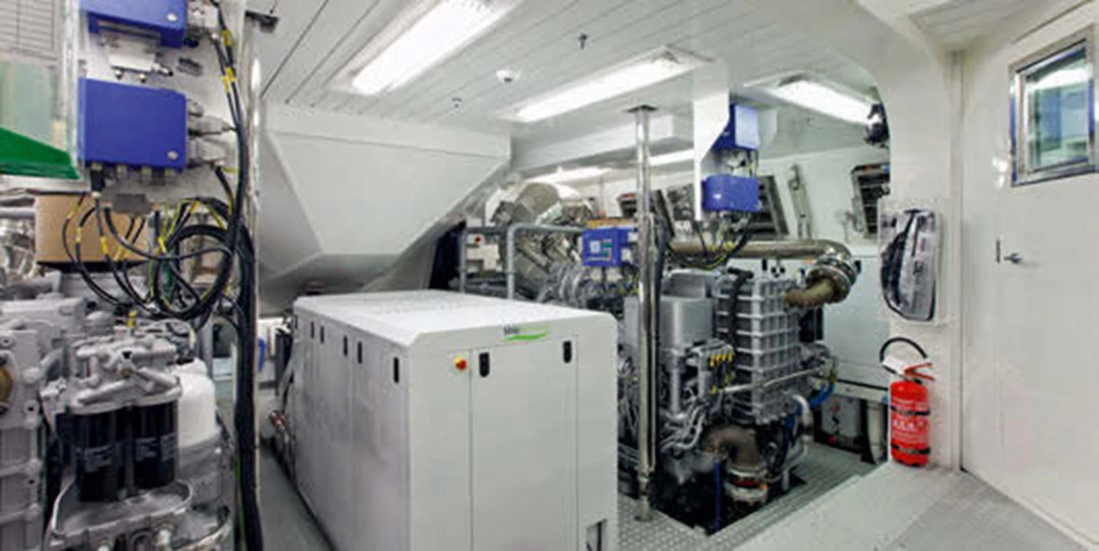 The image showcases the well-organized and high-tech engine room of the yacht. aboard RUSH Yacht for Sale