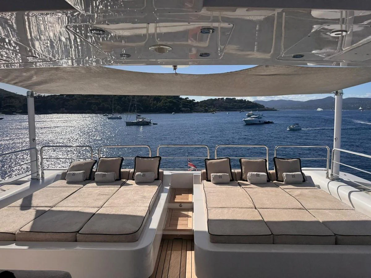 The sundeck offers luxurious sunbeds with a stunning view of the surrounding waters. aboard RUSH Yacht for Sale