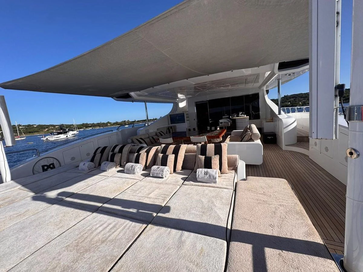 The sundeck offers a luxurious lounging area with plush cushions and ample shade. aboard RUSH Yacht for Sale