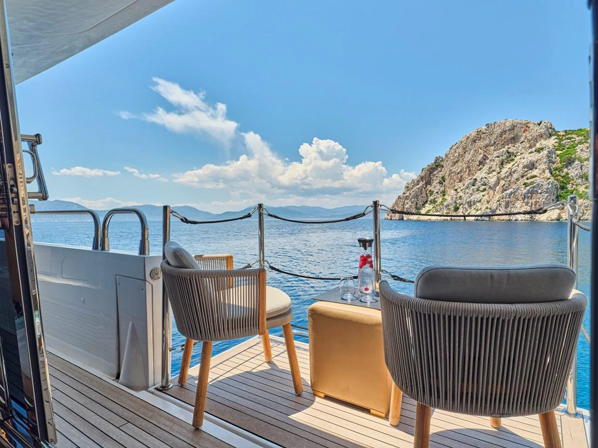 The aft deck offers a serene seating area with stunning views of the surrounding waters and landscape. aboard BLADE I Yacht for Sale