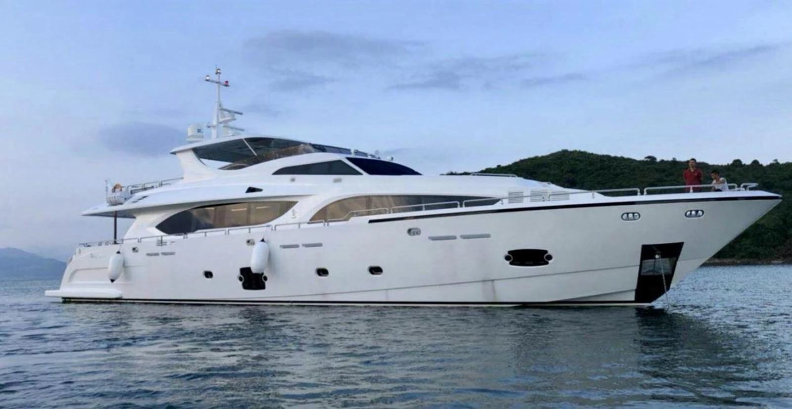 A sleek and modern yacht glides gracefully on calm waters against a serene backdrop. aboard HEYSEA ASTERIA 126/1 Yacht for Sale