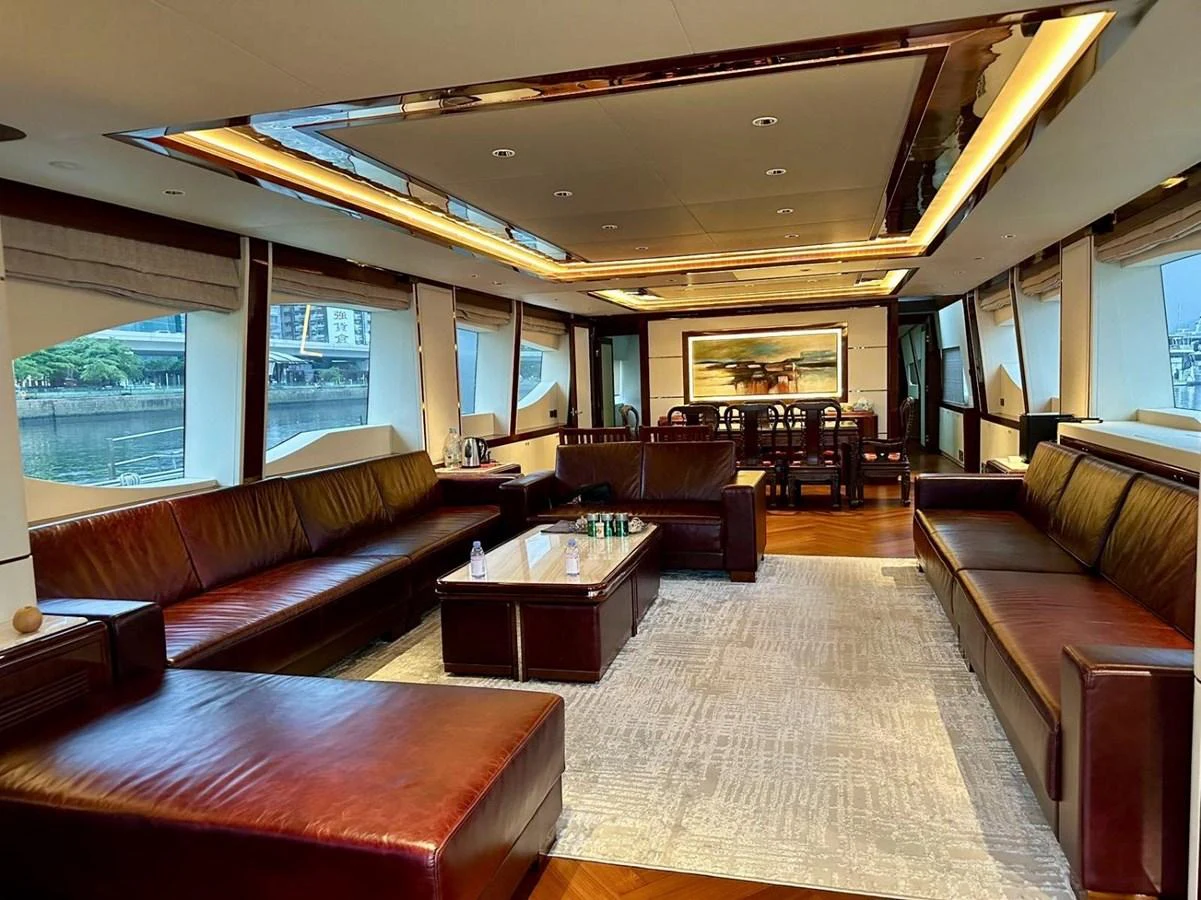 The salon features luxurious leather seating and large windows offering panoramic views. aboard HEYSEA ASTERIA 126/1 Yacht for Sale