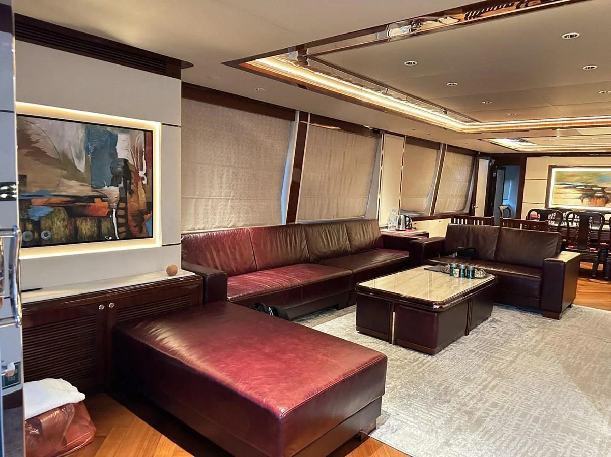 The yacht's salon features luxurious leather seating, a large coffee table, and elegant decor. aboard HEYSEA ASTERIA 126/1 Yacht for Sale