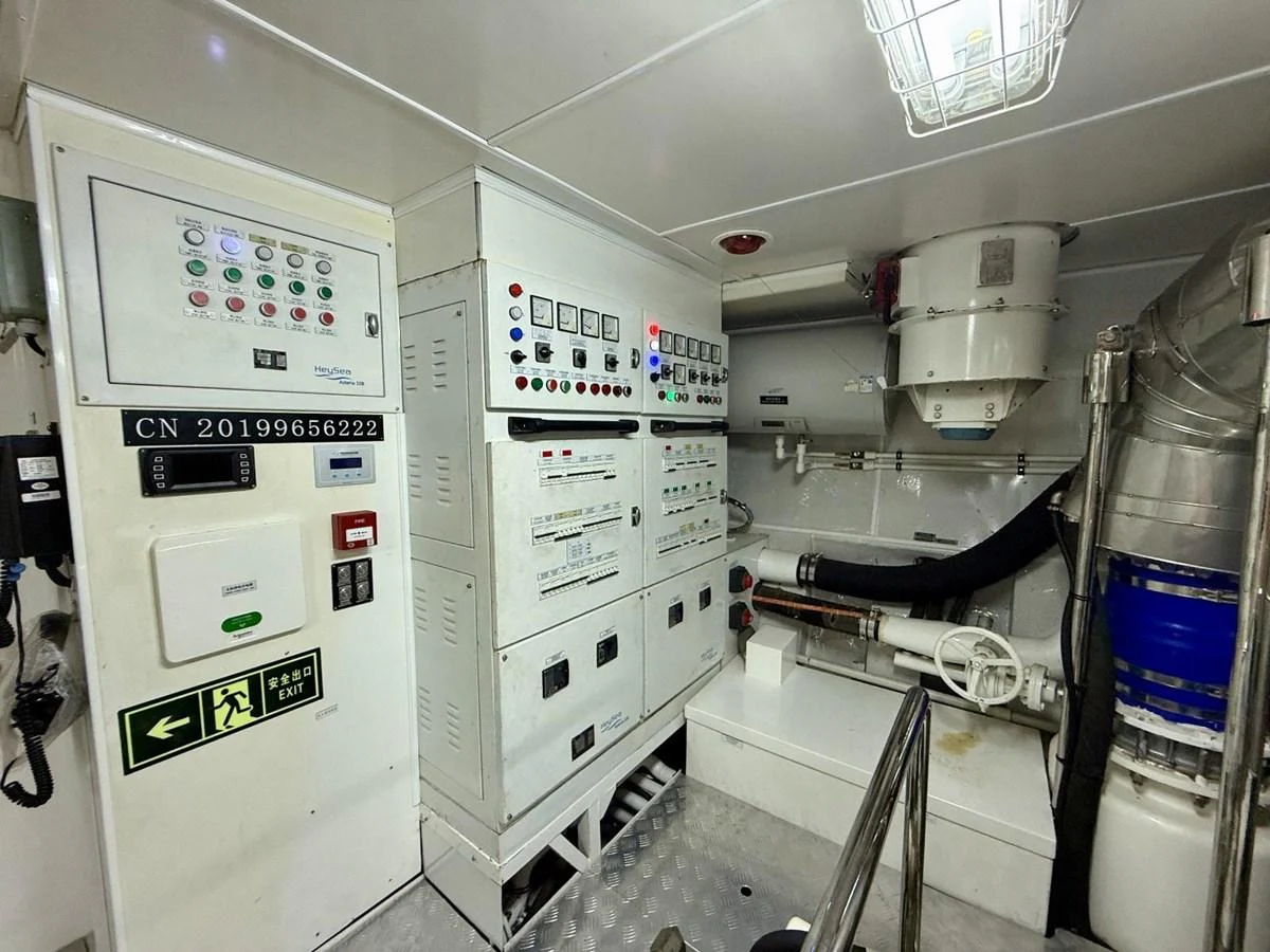 The engine room features a well-organized control panel and essential machinery. aboard HEYSEA ASTERIA 126/1 Yacht for Sale